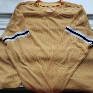 A yellow long sleeved shirt